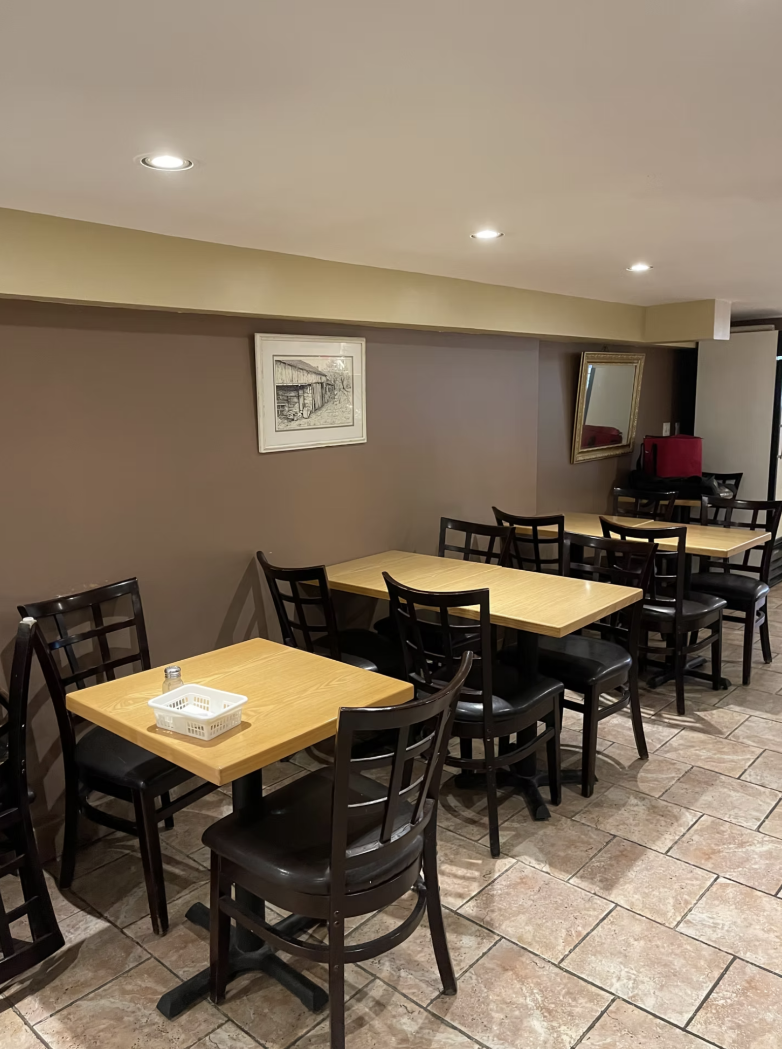 The cozy Econo Pizza & Diner dining room, ready for a casual meal with family and friends.